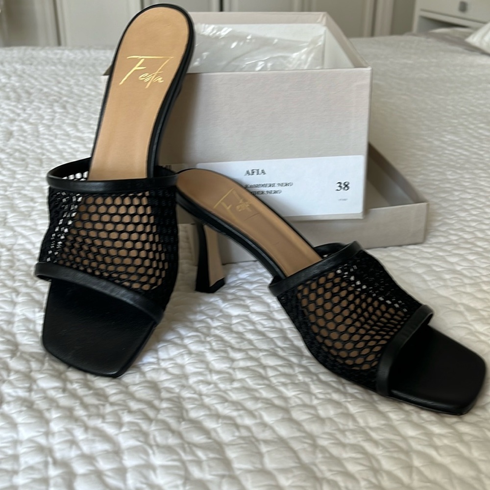 Never worn black woven slides.